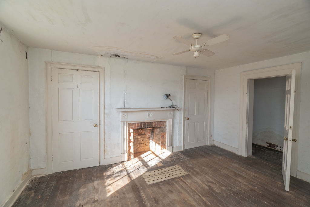 Fishback House living room with original fireplace.